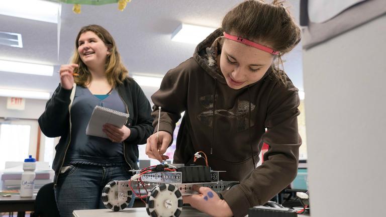 Students working with robot