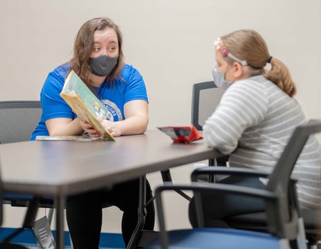 Teacher reading to student